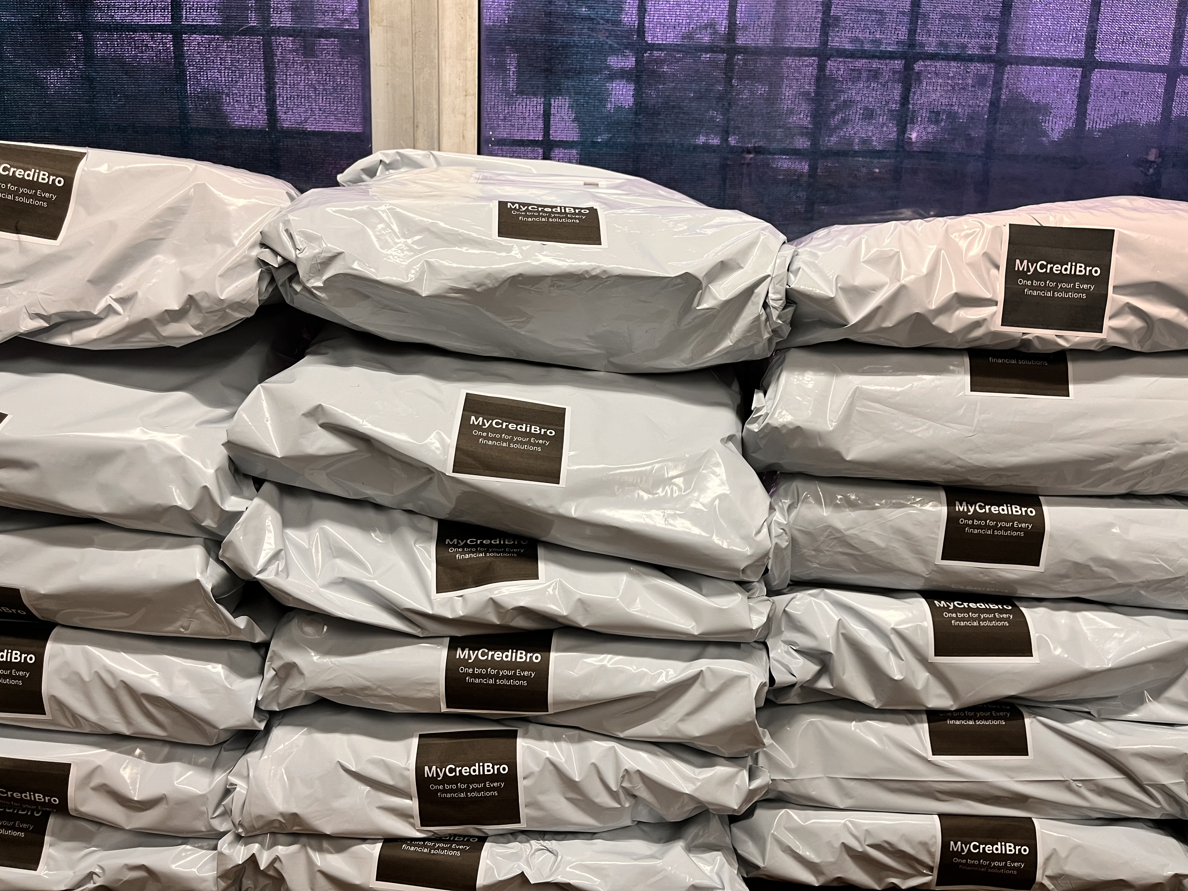 Sealed gift parcels at the MyCrediBro packing desk
