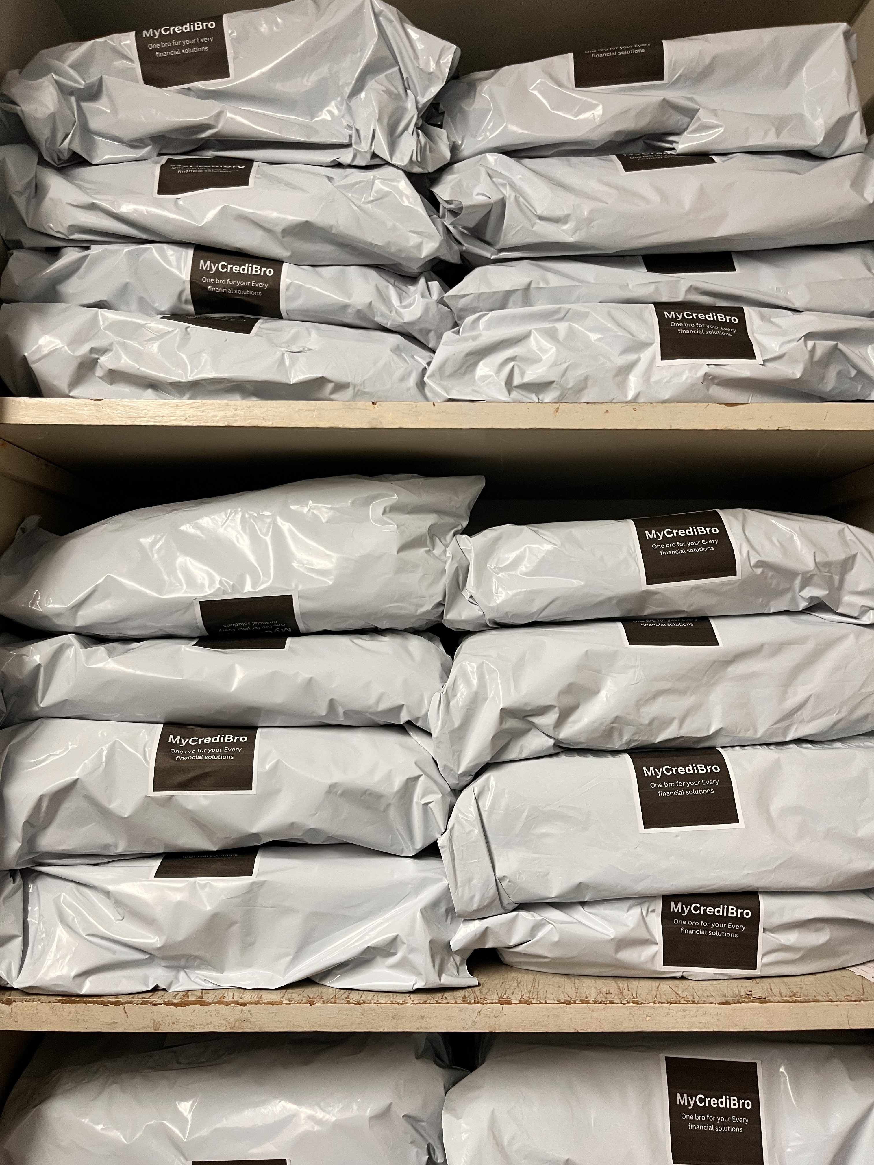 Courier-ready MyCrediBro gift parcels with address labels